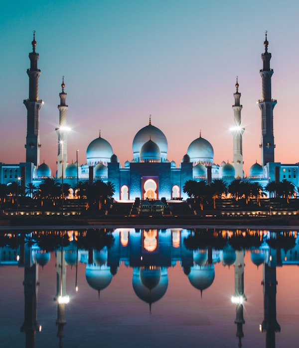 Sheikh Zayed Grand Mosque Abu Dhabi - featured in premium city tours with stunning white marble architecture and reflection pools
